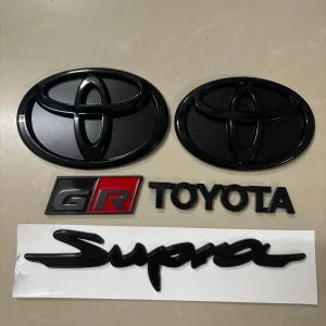 Toyota A90, A91 Used OEM Emblem Badge matte black, red accent A90