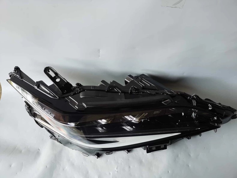 Genuine Lexus ES OEM LED headlight three-quarter top view - LEXUS embossed housing and LED projectors