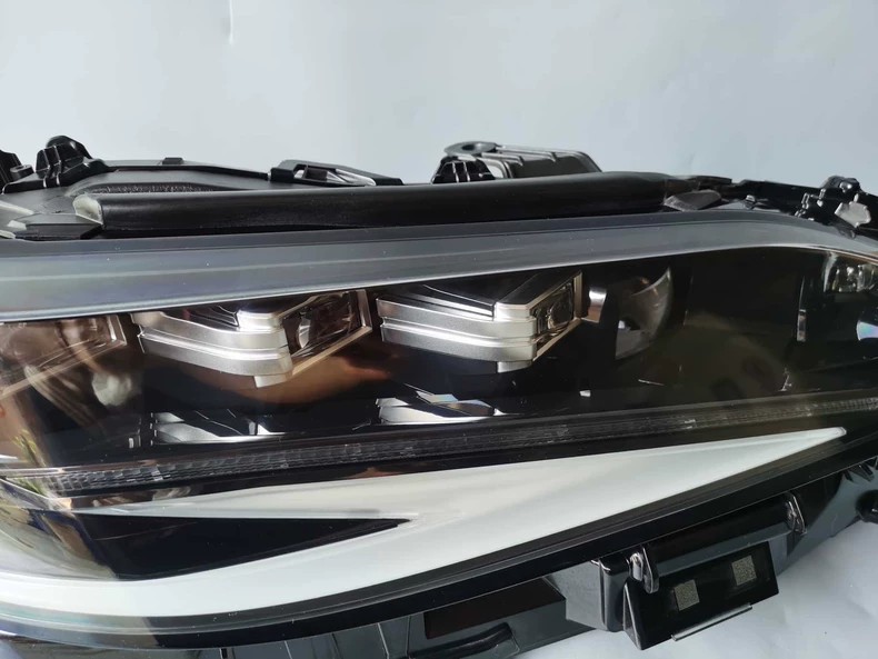 Genuine Lexus ES OEM LED headlight close-up - projector housings and module mounting area