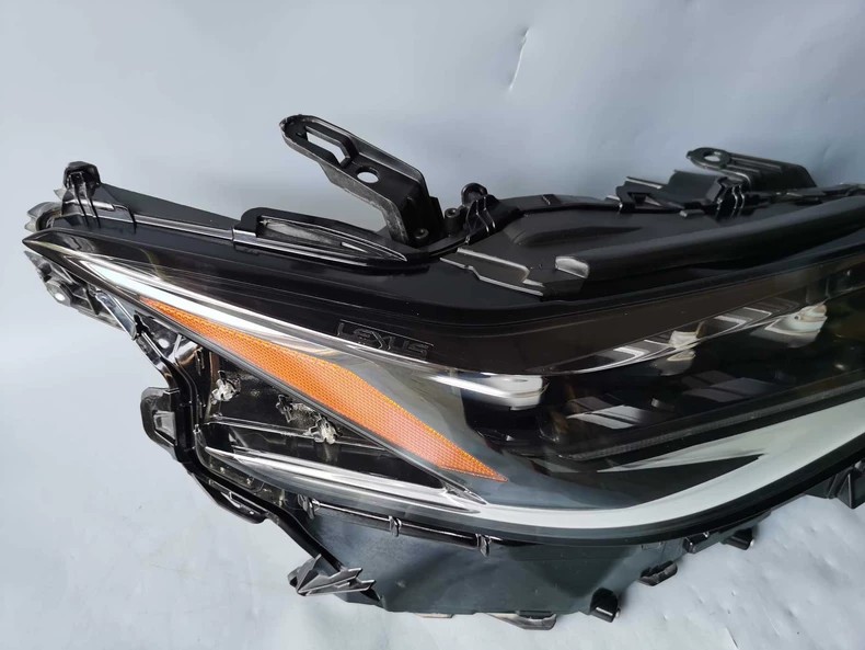 Genuine Lexus ES OEM LED headlight three-quarter front view - LED DRL and clear lens