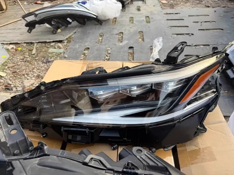 Lexus ES triple-beam LED headlight left angle view
