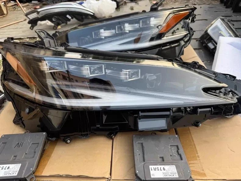 Close-up of Lexus ES triple-beam LED headlight lens