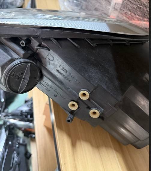 Porsche 996 986 used headlight lower housing close-up with bulb access cap and drain tube
