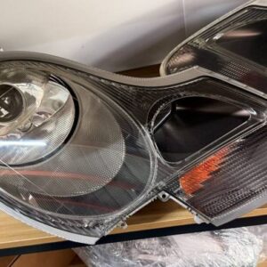 Porsche 996 986 pre-facelift headlight assembly front lens view with round main lamp and turn signal