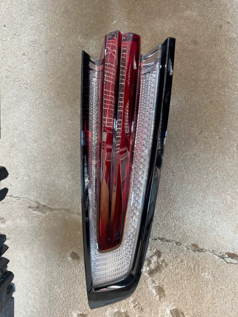 Porsche Cayenne 9YA tail light close-up, red lens and honeycomb reflector